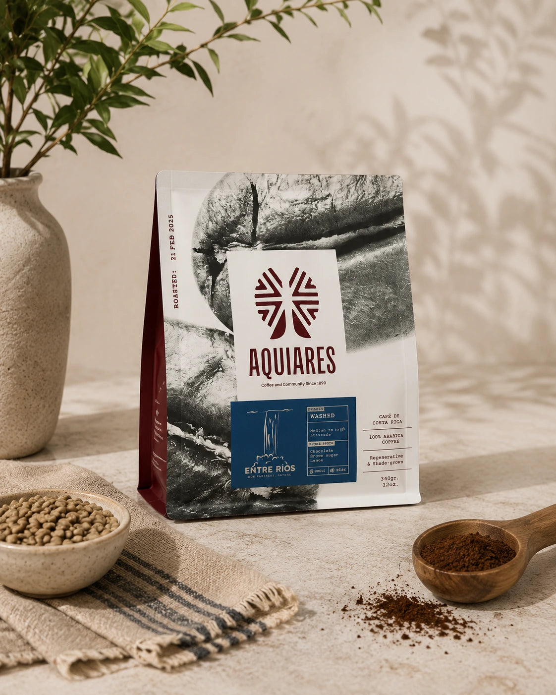 Aquiares Entre Ríos 100% Arabica Costa Rican coffee, regenerative and shade-grown, displayed with ground coffee and natural styling.