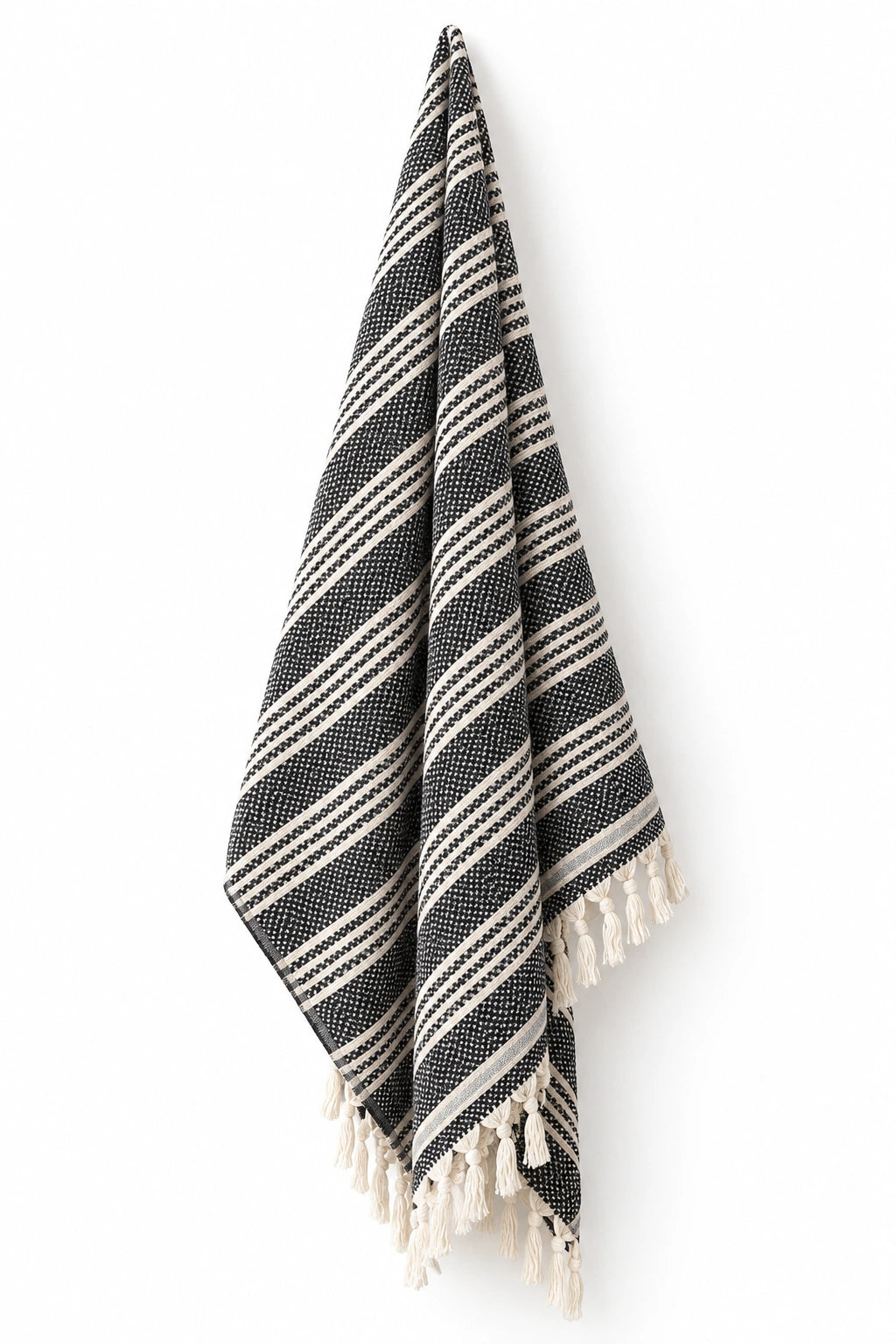 Mevsim Turkish cotton peshtemal towel in black and natural ivory stripes with hand-tied tassels.