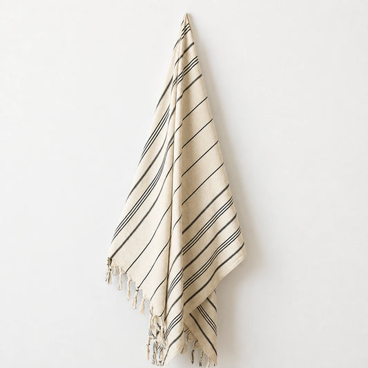 Lale cotton-linen Turkish towel in natural ivory with fine black woven stripes and hand-knotted tassel fringe.