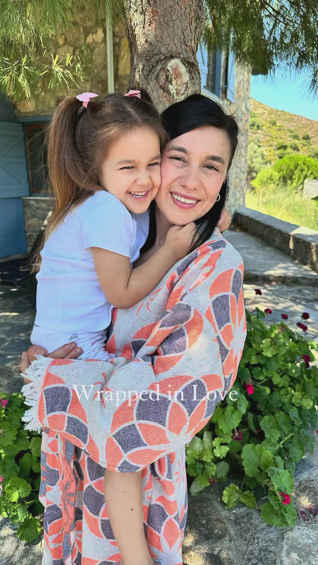 Load video: Women wearing light blue artisan Turkish cotton kimono robes outdoors with a child, highlighting natural fibers, craftsmanship, and everyday family moments.